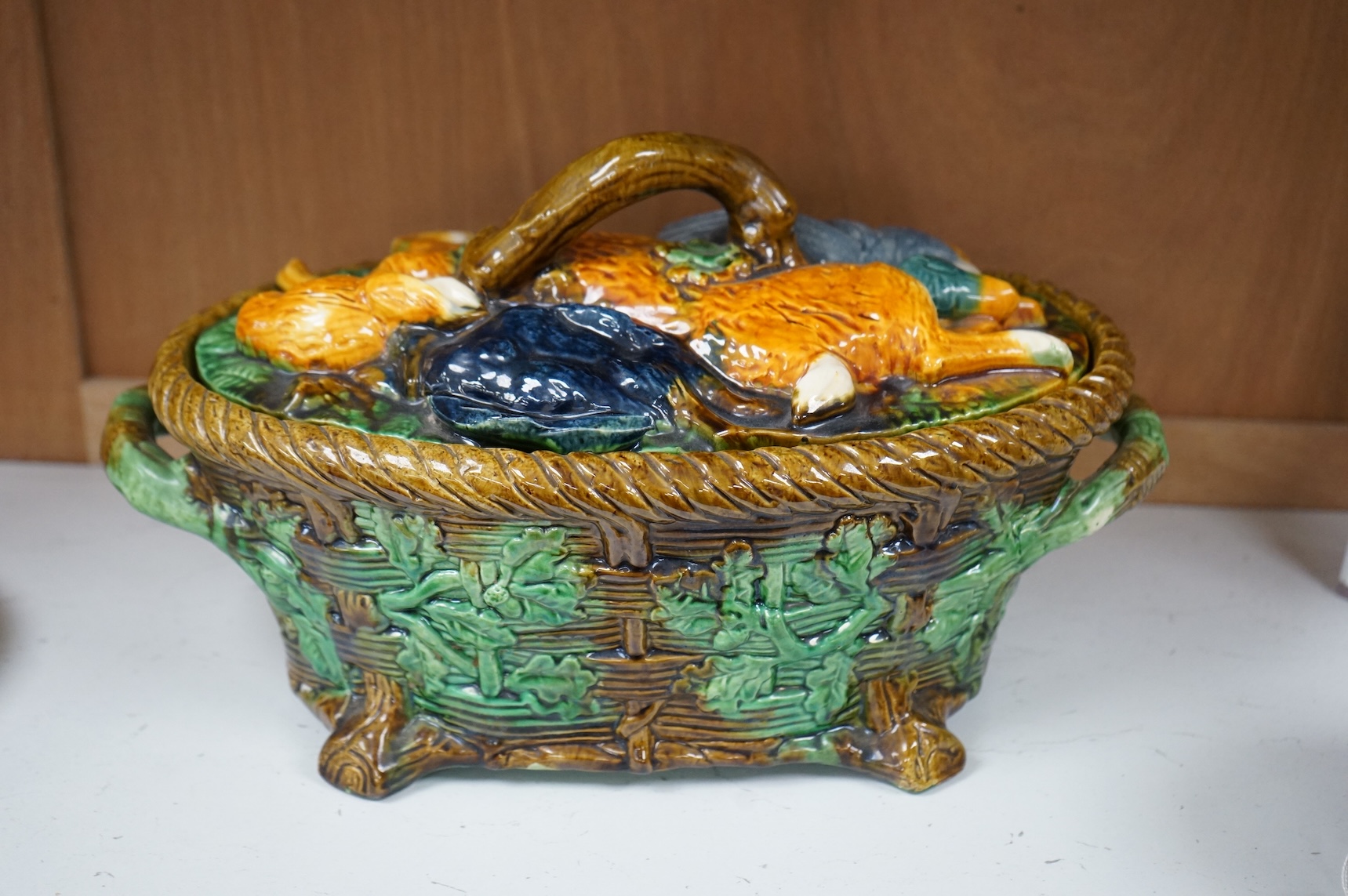 A majolica style game pie dish, 37cm wide